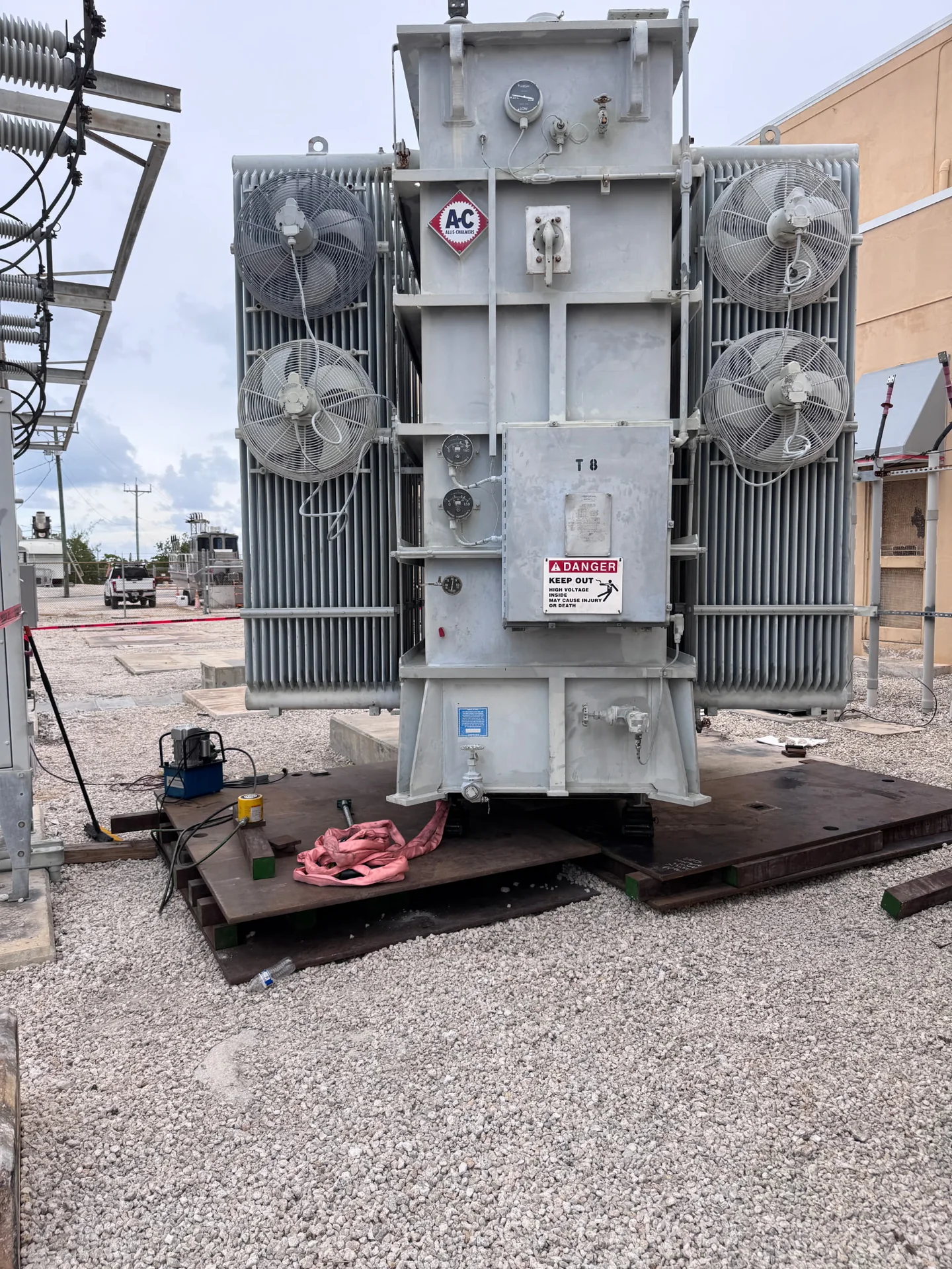 Front view of a large substation transformer with cooling fans and radiator banks